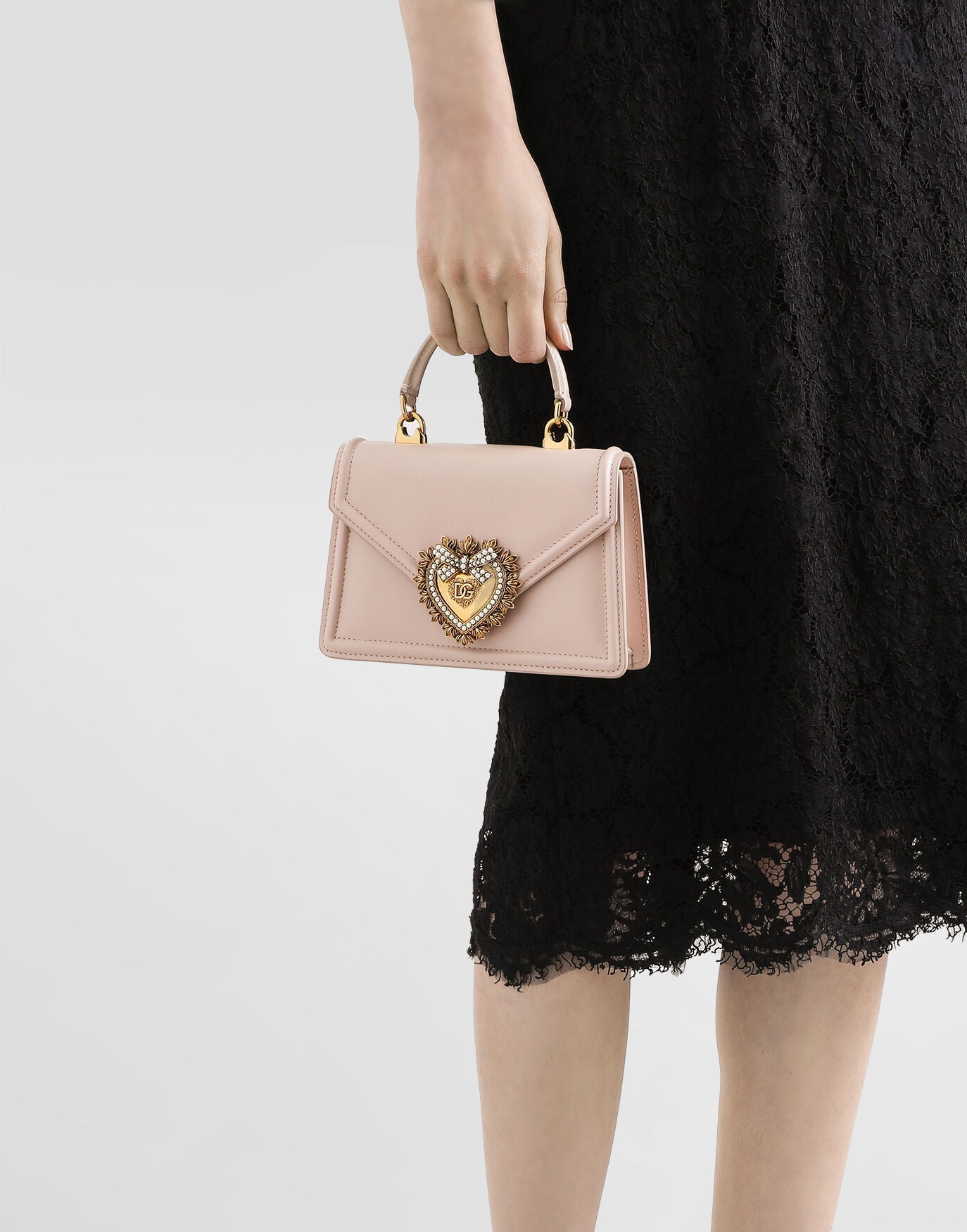 Model with Dolce & Gabbana Small Smooth Calfskin Devotion Bag for hire at Style Me Up, designer dress and accessory hire in Central Coast, NSW, Australia.